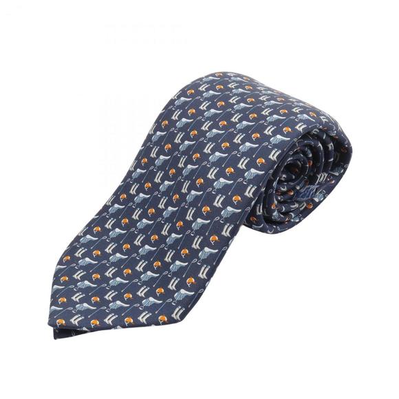 Hermes Hermès TENUE DE JOCKEY silk tie for men available in navy and orange.